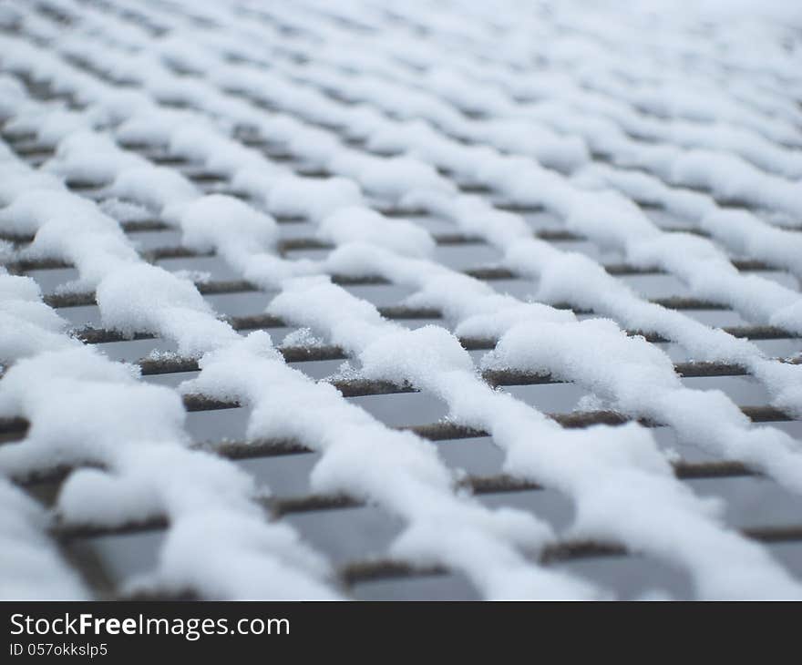 Grid close-up, grid in the snow, texture grid. Grid close-up, grid in the snow, texture grid