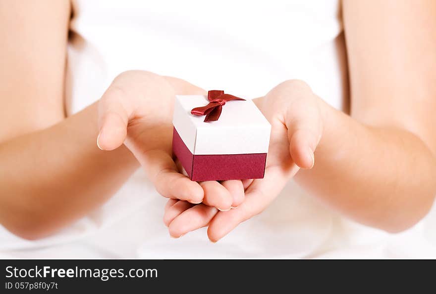 Small gift box in women's hands. Small gift box in women's hands