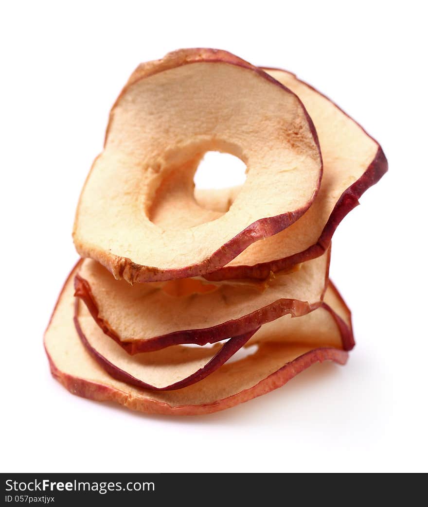 Dried apples in closeup on a white background