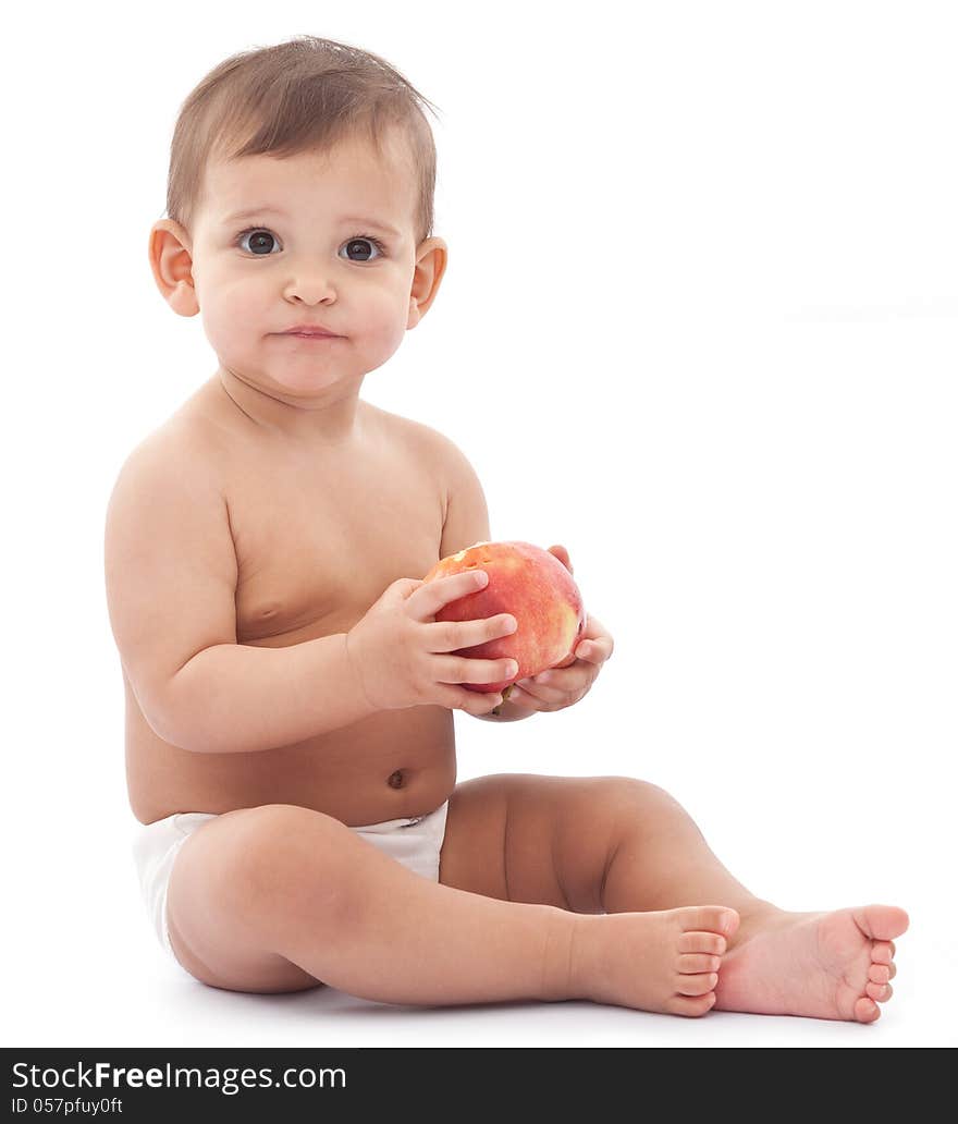 Cute confused little girl with apple in her arms. Isolated on a white background. Cute confused little girl with apple in her arms. Isolated on a white background.