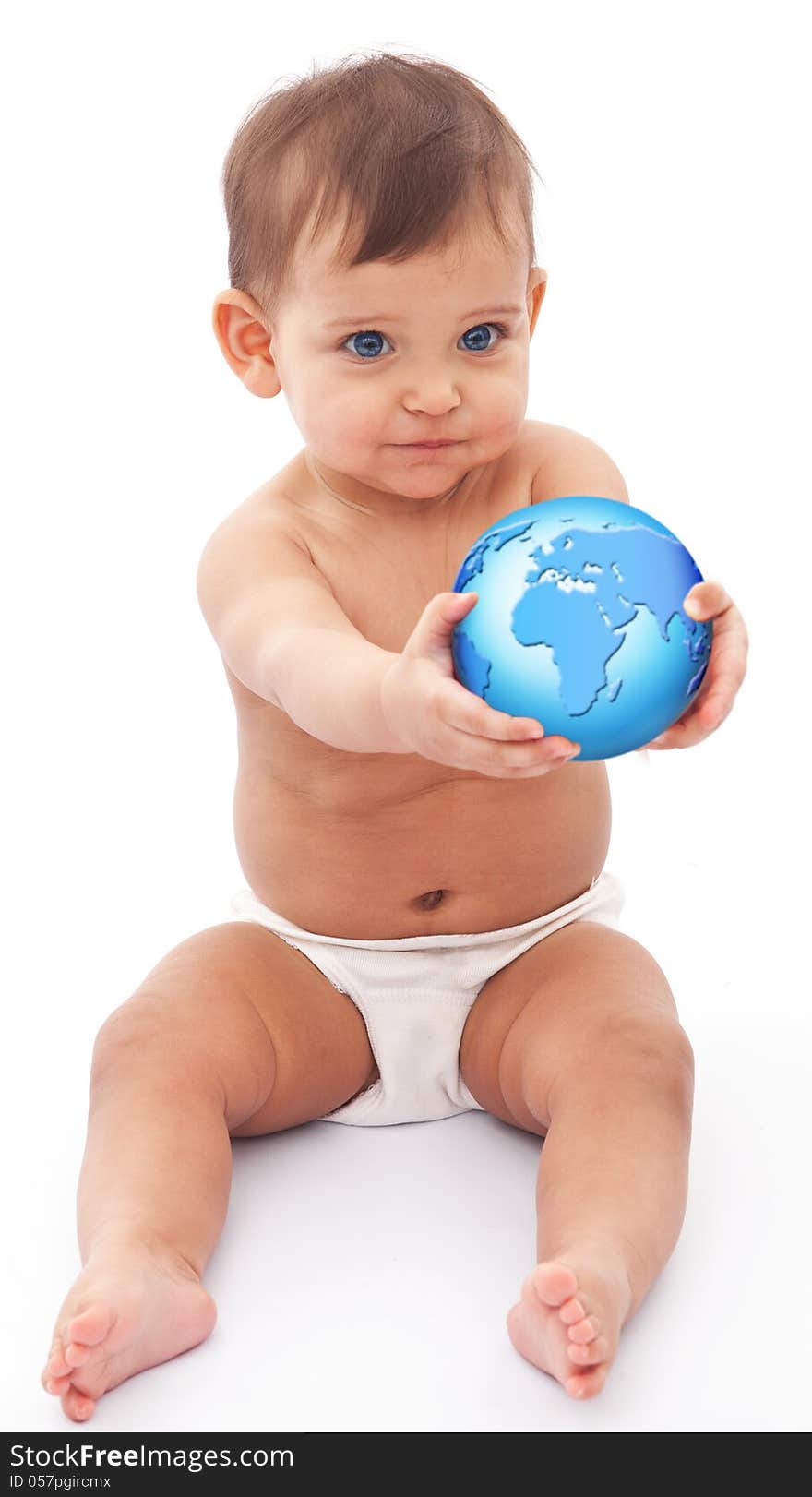 Baby sits at the floor with globe in her hand. Isolated on a white background. Baby sits at the floor with globe in her hand. Isolated on a white background.