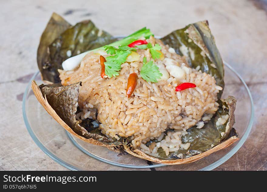 Season rice and lotus seed steamed in lotus leaf