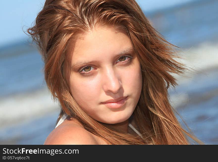 Closeup of a young woman on the beach. Closeup of a young woman on the beach