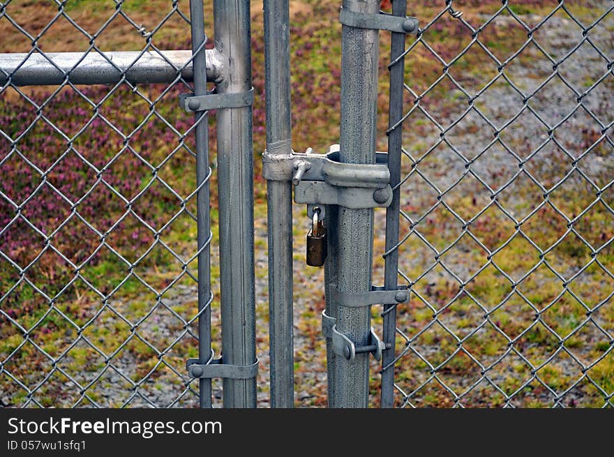 An image of a security fence with a Lock