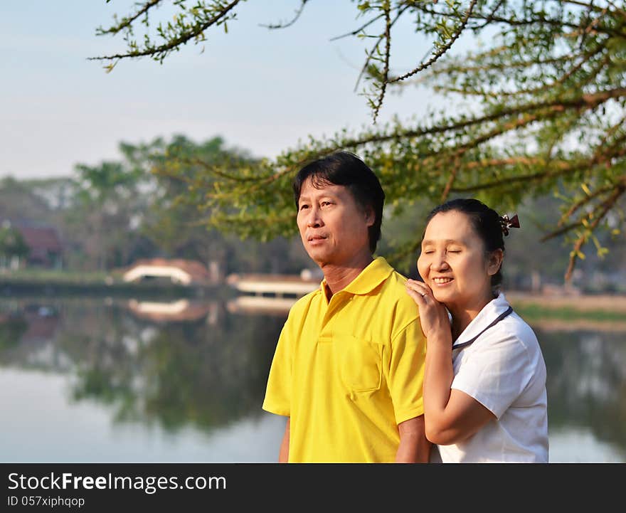 Happy couple at beautiful park outdoor in nature