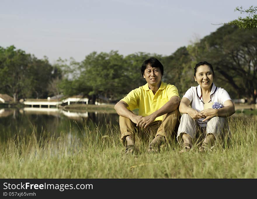 Happy Family Posing for A Portrait in the Park