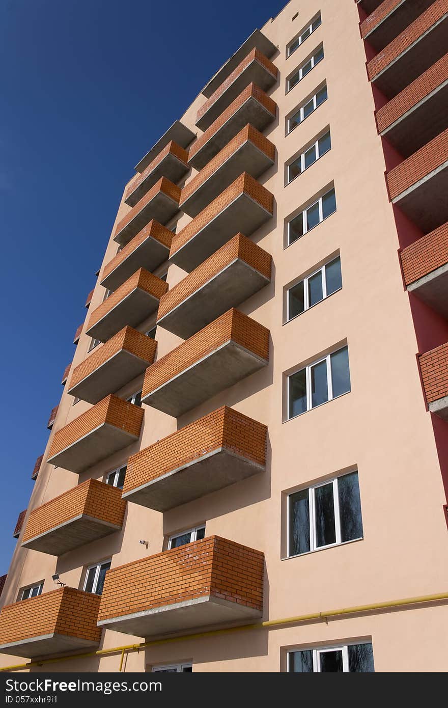 Apartment building on a blue sky