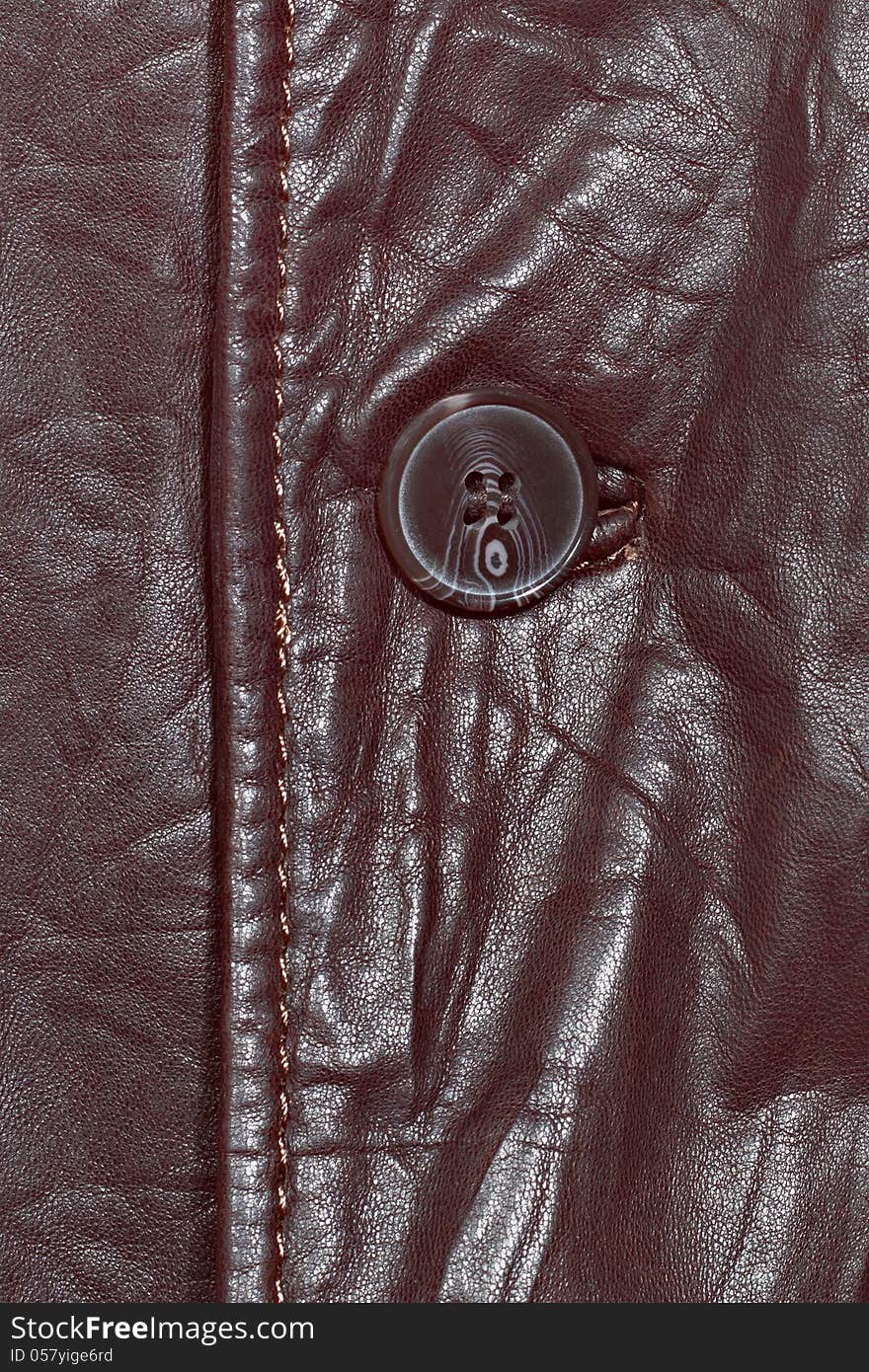 Brown leather shiny texture with seam and button. Brown leather shiny texture with seam and button