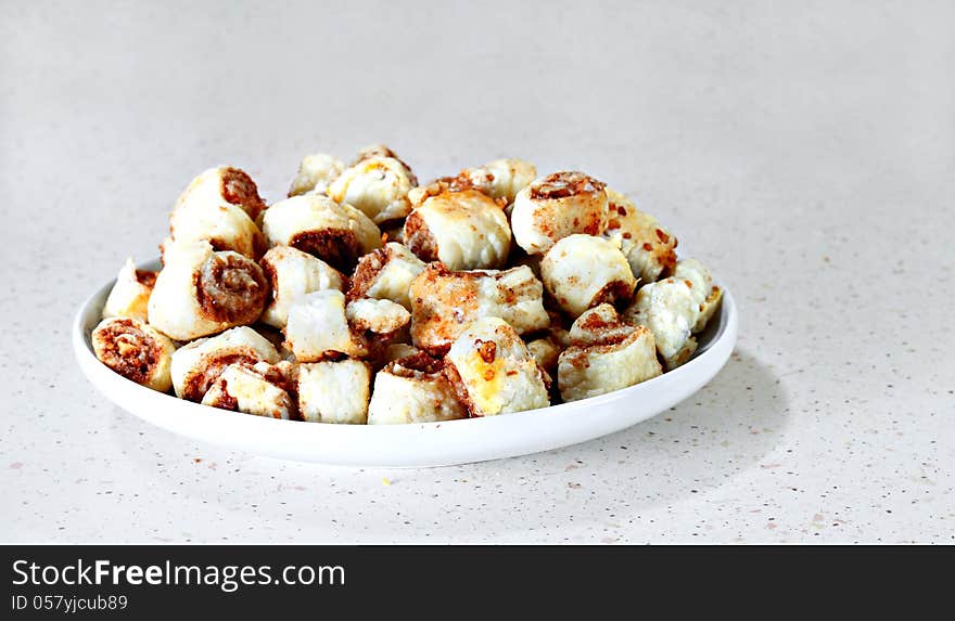 Dish of cinnamon buns on gray table