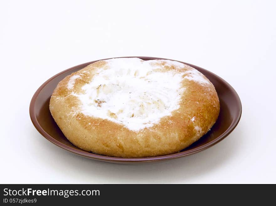 Cheese cake on a brown saucer