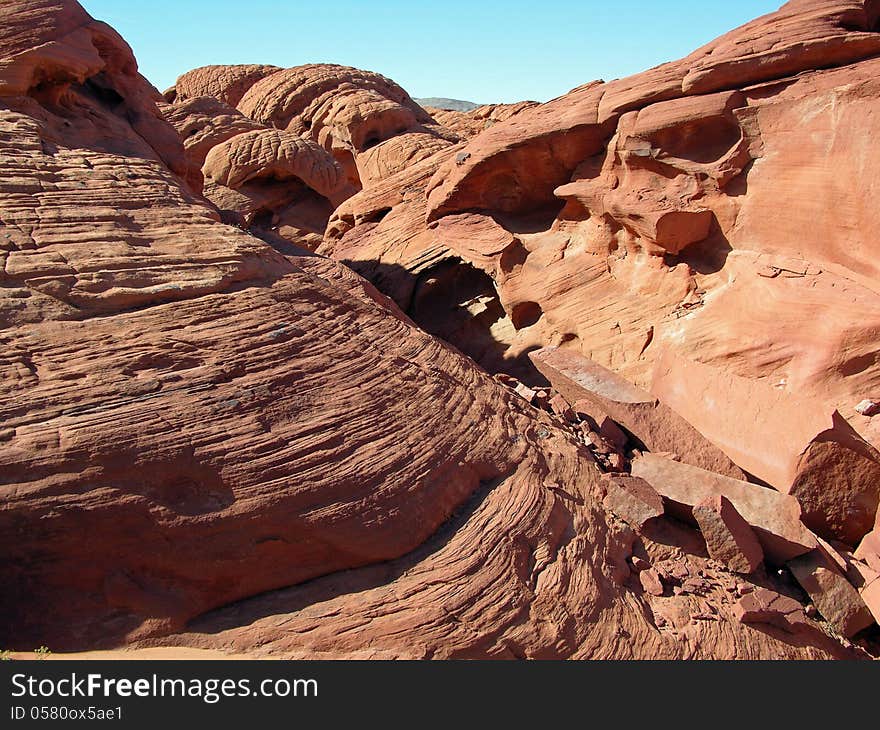 Redstone is on the North Shore Drive in Lake Mead NRA. It is about 40 miles outside of Las Vegas, about 20 miles past the Callville Bay cutoff and about 10 away from the Echo Bay junction. Heavily eroded fossil sand dunes from the Jurassic Period date back 120 million years ago. Redstone is on the North Shore Drive in Lake Mead NRA. It is about 40 miles outside of Las Vegas, about 20 miles past the Callville Bay cutoff and about 10 away from the Echo Bay junction. Heavily eroded fossil sand dunes from the Jurassic Period date back 120 million years ago.