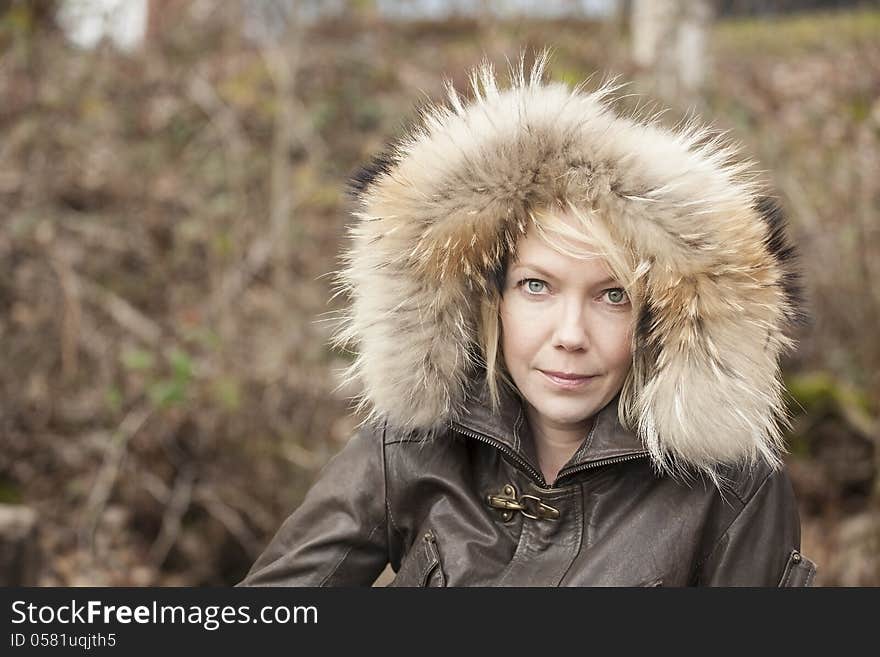 Portrait of a blonde woman in attractive winter coat. Portrait of a blonde woman in attractive winter coat.