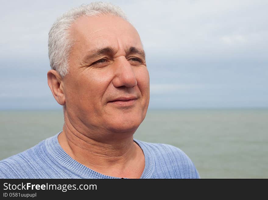 Closeup of a elderly man smiling outdoors. Closeup of a elderly man smiling outdoors