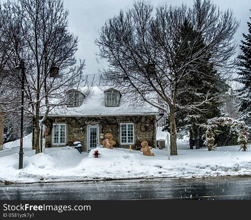 A old stone house turn in to a dairy shop on a snowy day. A old stone house turn in to a dairy shop on a snowy day