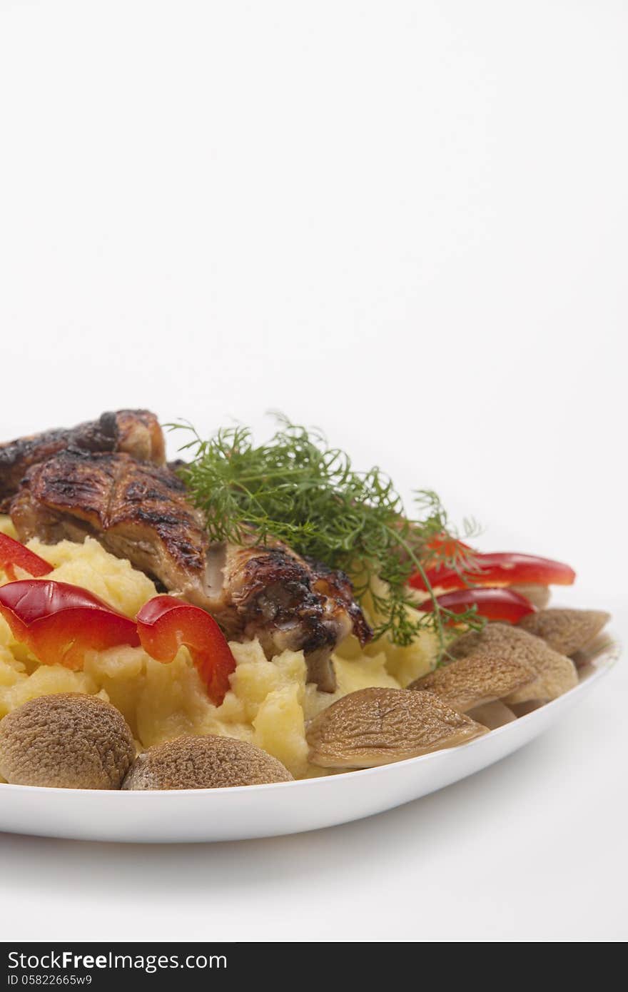 Grilled fresh meat with mash potato, mashrooms and vegetables. national belarussian food. Grilled fresh meat with mash potato, mashrooms and vegetables. national belarussian food