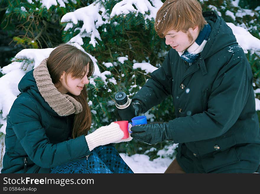 Couple drinking tea in winter