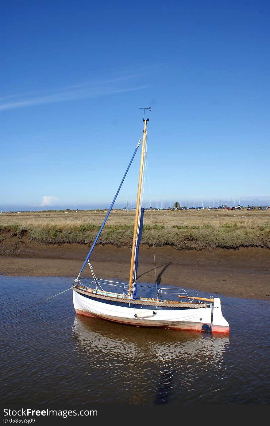 Yacht waiting for the high tide in Blakeney Harbor. Yacht waiting for the high tide in Blakeney Harbor