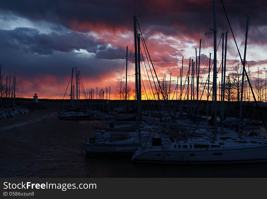 The photo was taken at a marina on Kentucky Lake just as the evening sun was setting lighting up the clouds. The photo was taken at a marina on Kentucky Lake just as the evening sun was setting lighting up the clouds.