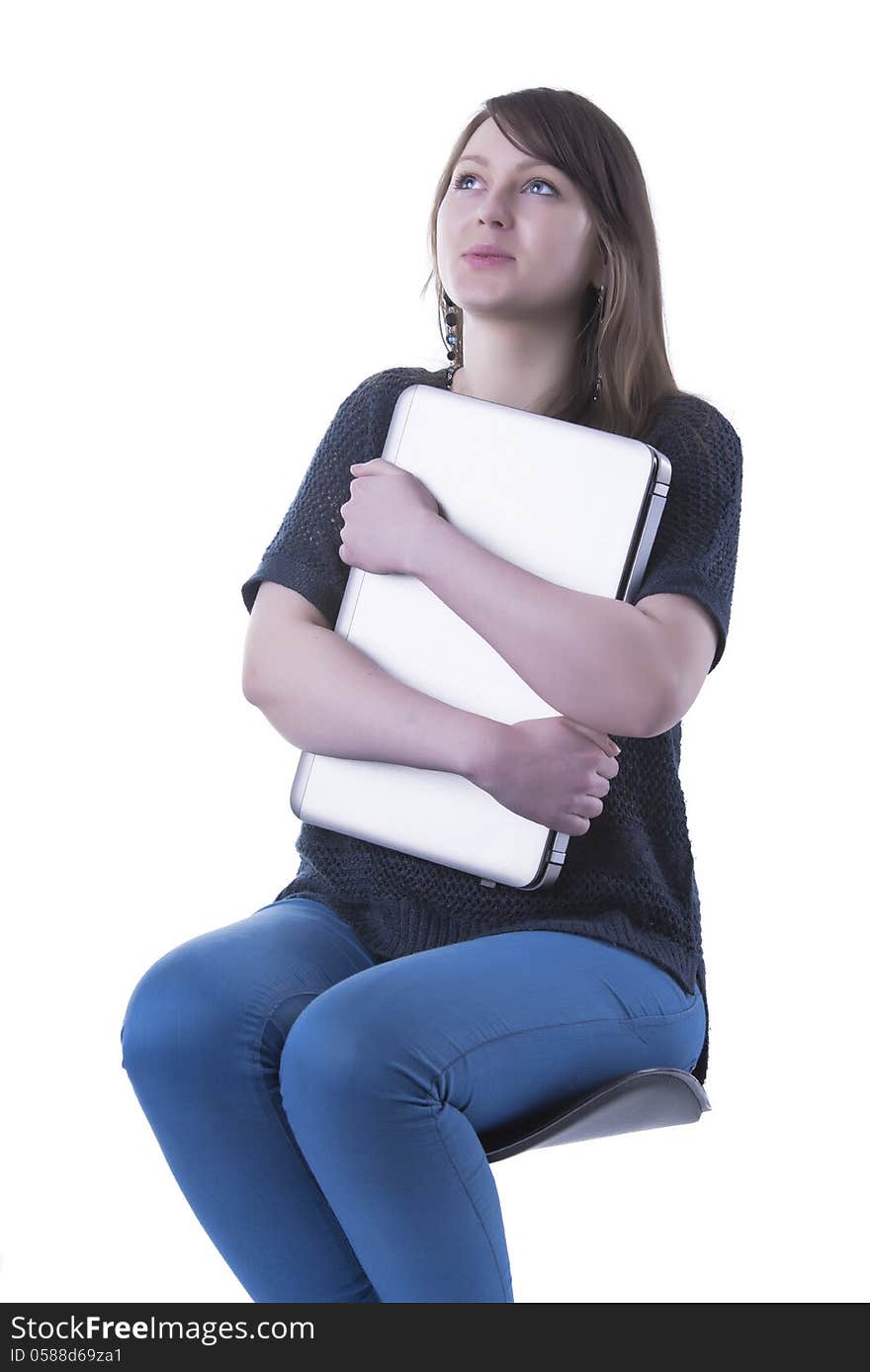 Casual student with computer in her lap. Isolated in our studio. Casual student with computer in her lap. Isolated in our studio.