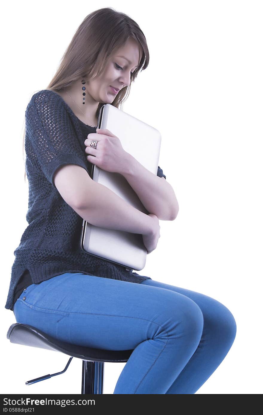 Casual student with computer in her lap. Isolated in our studio. Casual student with computer in her lap. Isolated in our studio.