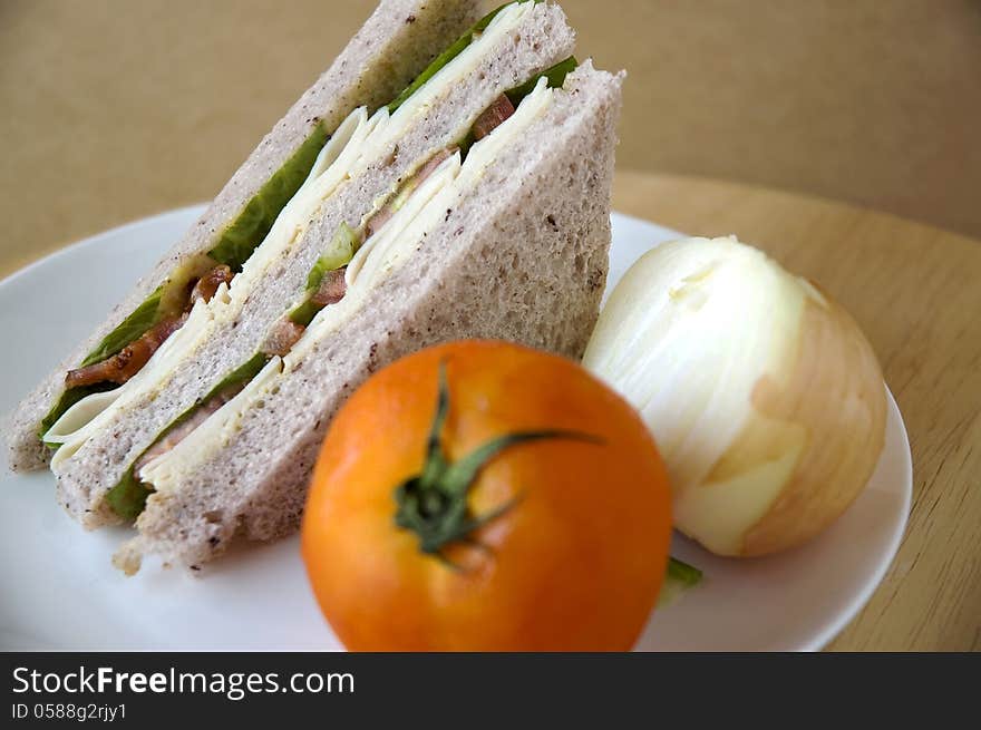 Sandwich on plate with tomato