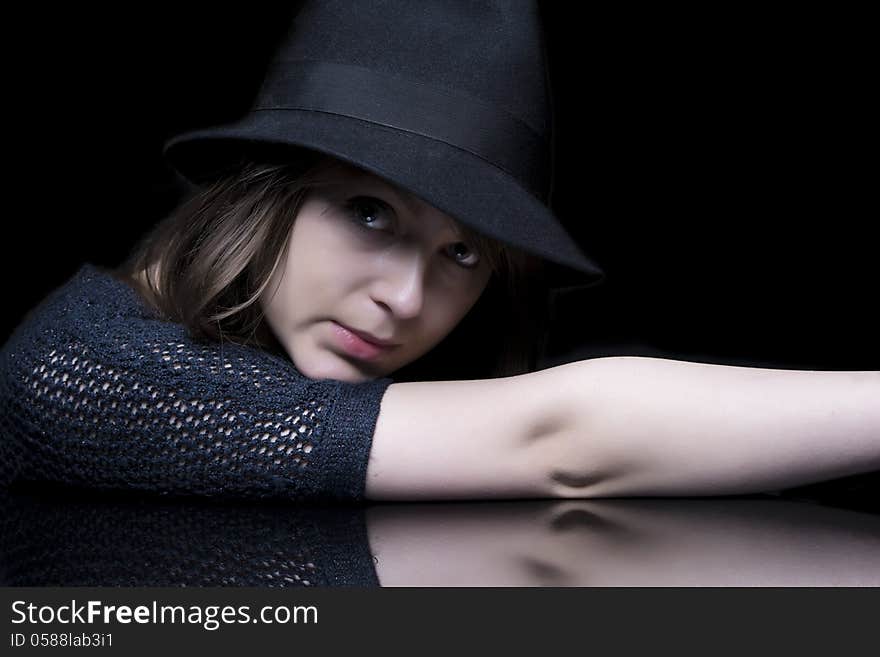 Girl in black with stylish black hat