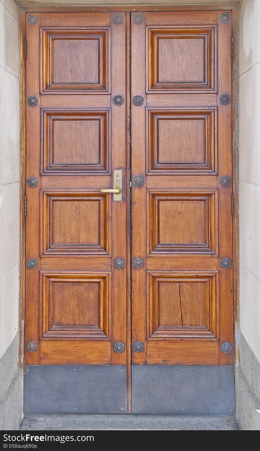 Wooden double doors with panelling. Wooden double doors with panelling