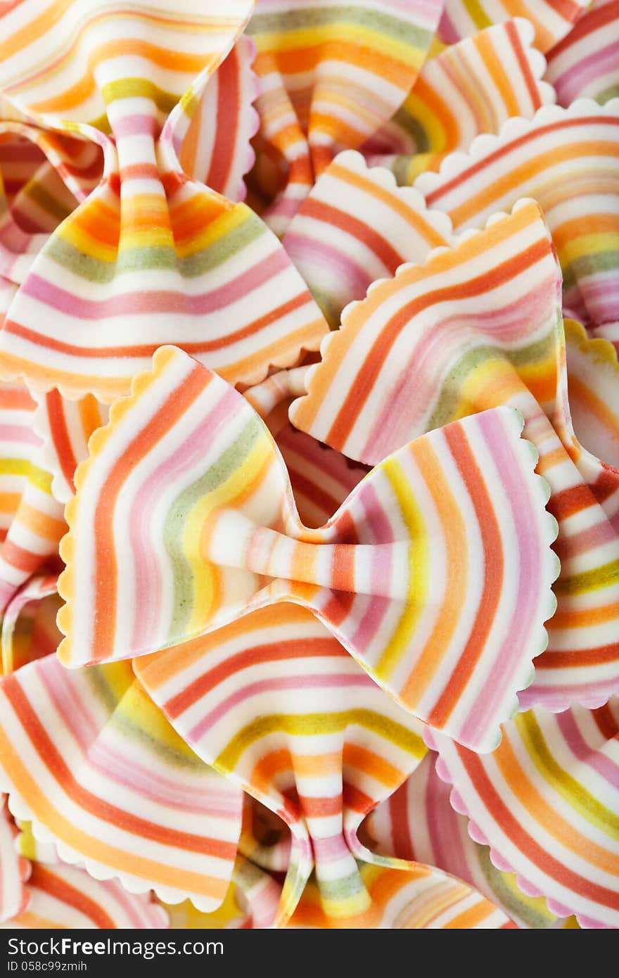 Fresh, gourmet bowtie dry pasta striped in a rainbow of colors.