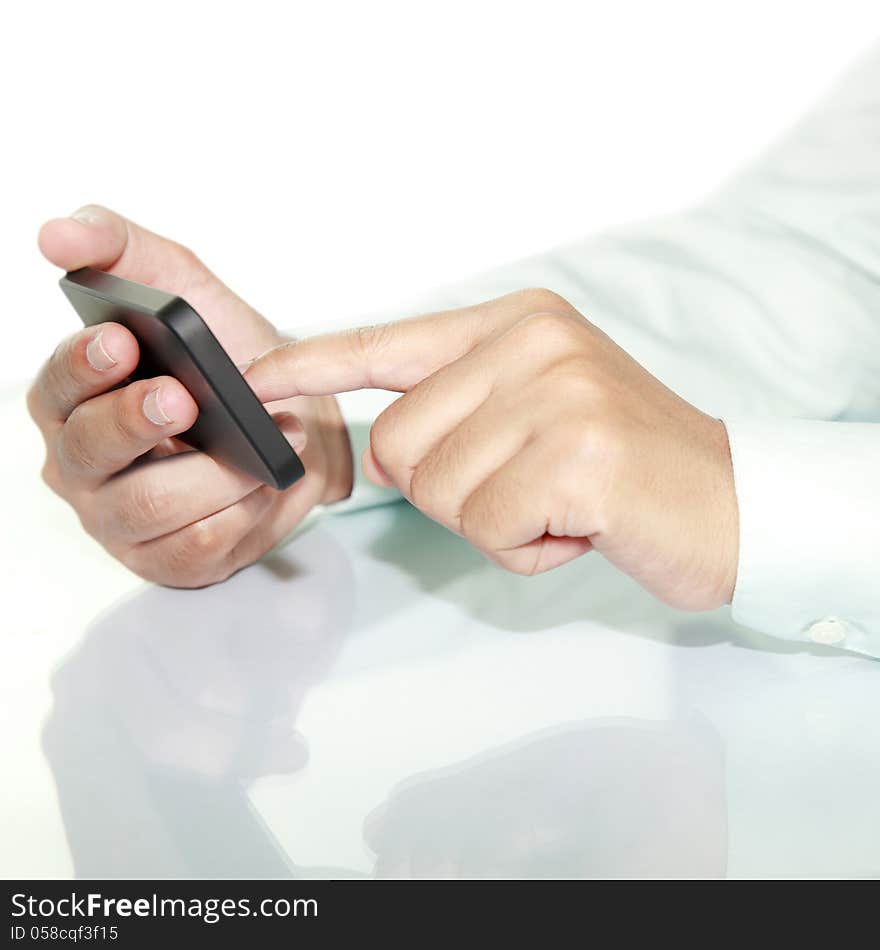 Businessman using phone on the desk