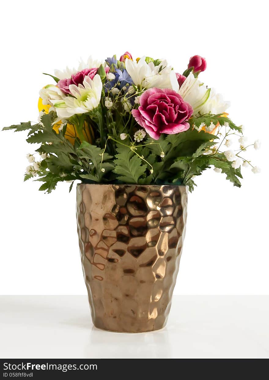 Flowers in a vase on white background. Flowers in a vase on white background.