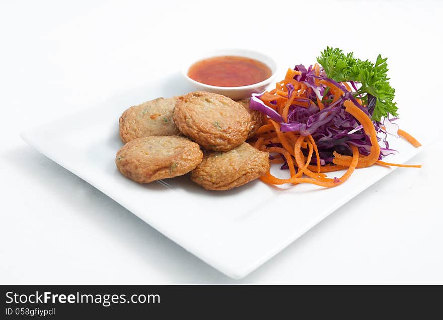 Thai entree, Fish cake. Made from fish and curry paste. Thai entree, Fish cake. Made from fish and curry paste.