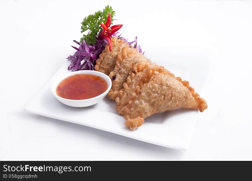 Thai popular entree,curry puff and sweet chili sauce. Thai popular entree,curry puff and sweet chili sauce.