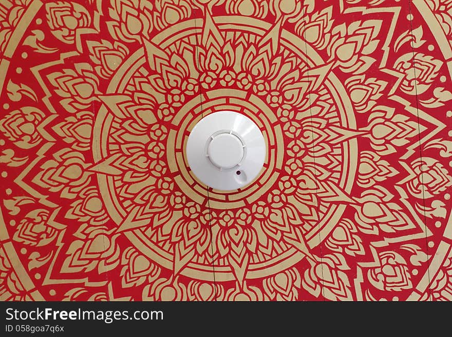 Smoke detector on Art pattern ceiling