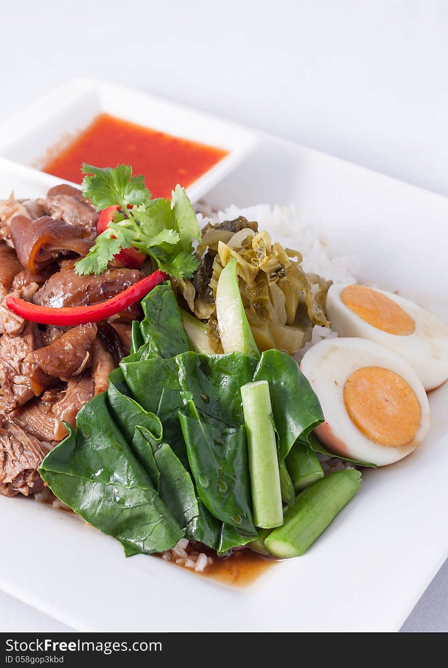 Pork stew with rice and vegetable,Thai fast food