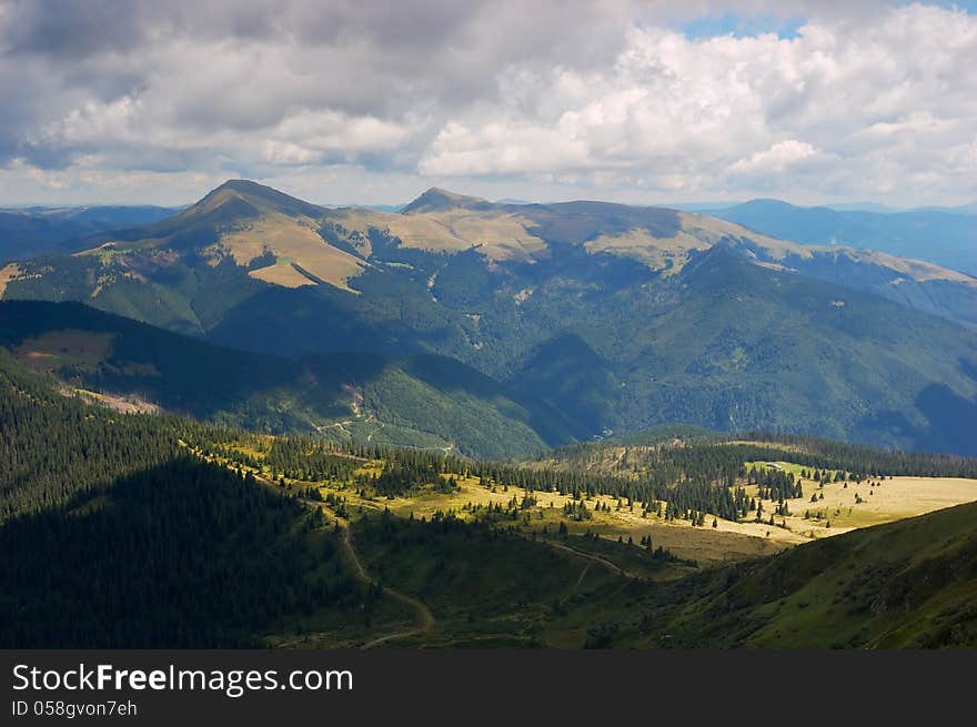 Summer mountain landscape with a cloudy sky. Summer mountain landscape with a cloudy sky