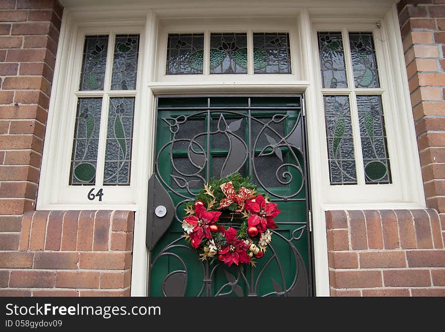 Red Brick Wall With A Green Door And Window