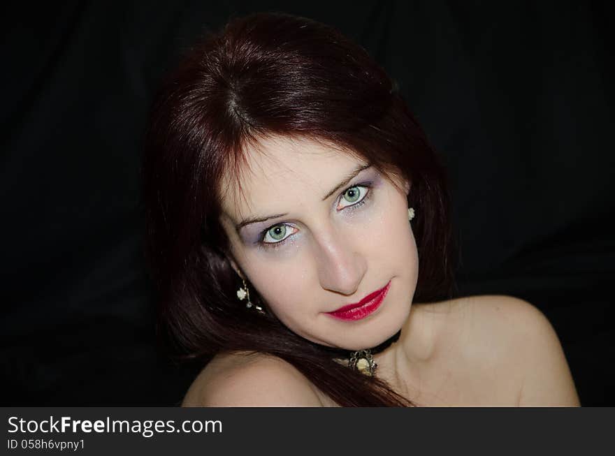 Beautiful woman face with green eyes