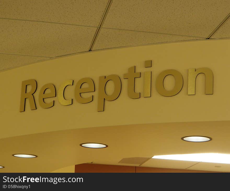 Brass colored sign in reception area of a doctor's office. Brass colored sign in reception area of a doctor's office.