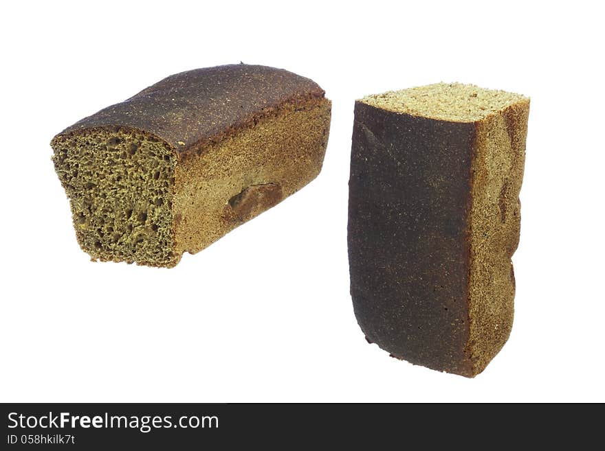 Loaf of rye bread, cut into two parts, isolated on white