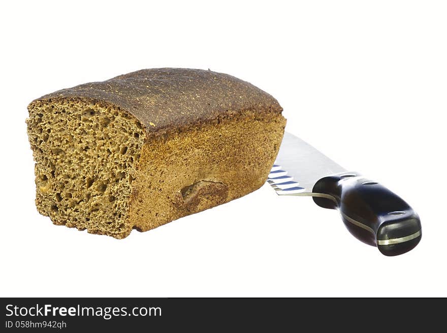 Half loaf of rye bread and knife isolated on white background. Half loaf of rye bread and knife isolated on white background