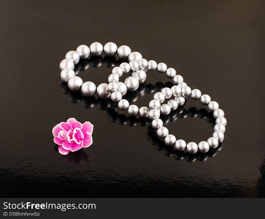 Pearl bracelets on a black background