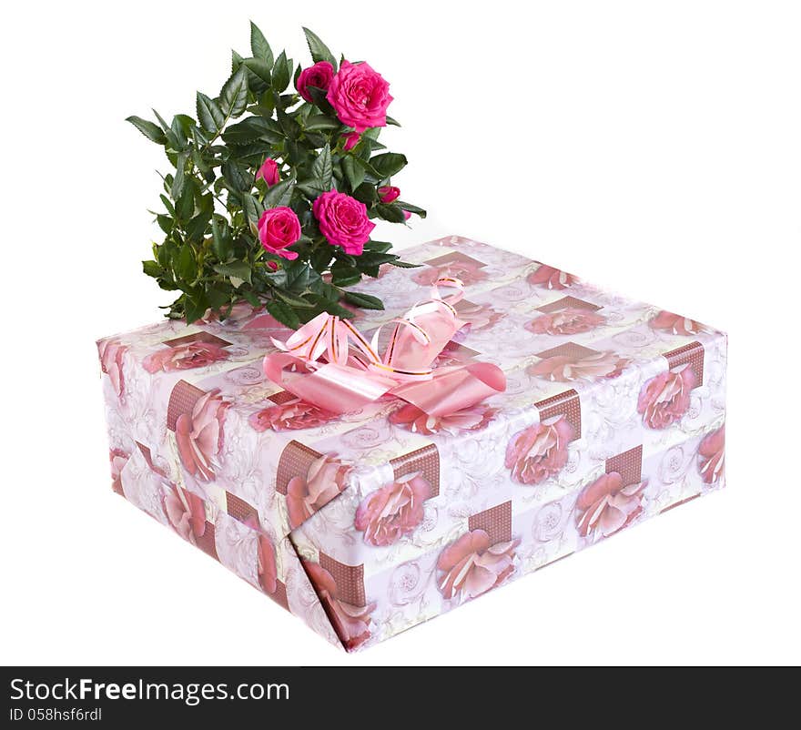 Box with a gift and bouquet of roses on a white background