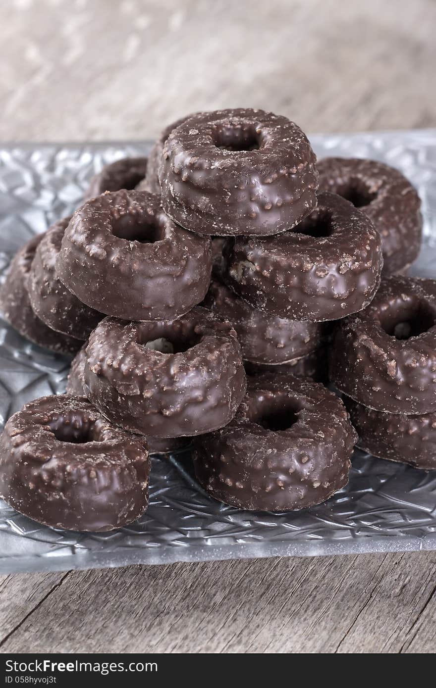 Chocolate tea biscuits on wooden table