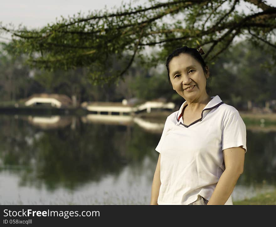 Portrait smiling woman outdoors in park