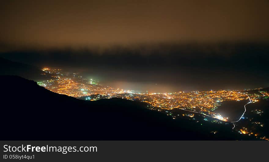 Night landscape from mountain top on the city on the seashore, panorama. Night landscape from mountain top on the city on the seashore, panorama