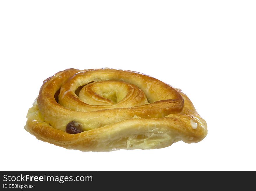 Bun with cream and raisins, isolated on white background