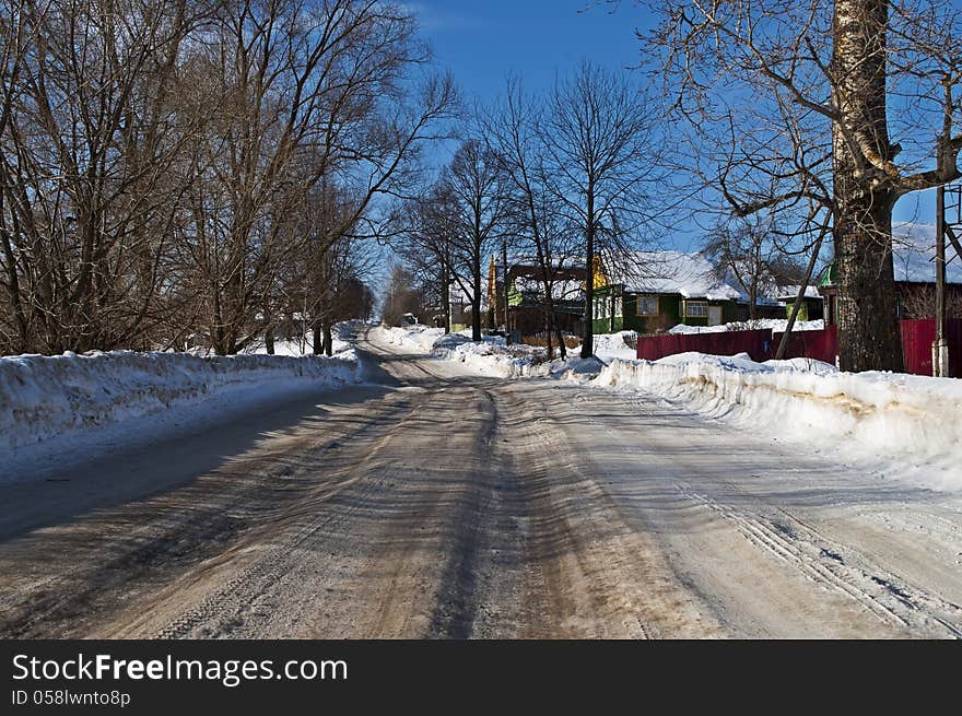 Snowy road in a village