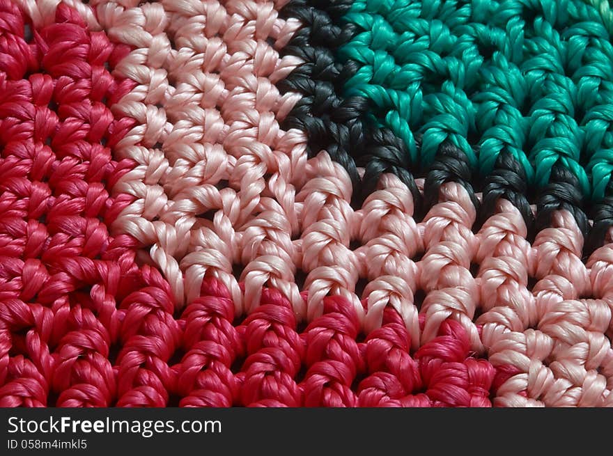 Detail of colorful knitted blankets pillows. Detail of colorful knitted blankets pillows