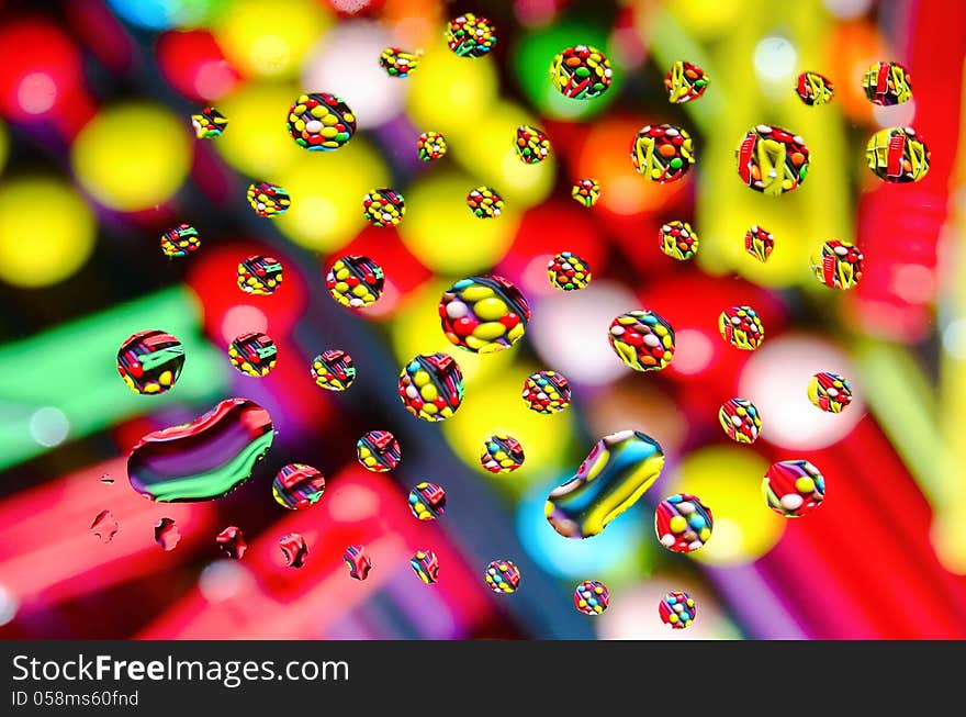 Abstract background of colored drops on the glass. Abstract background of colored drops on the glass