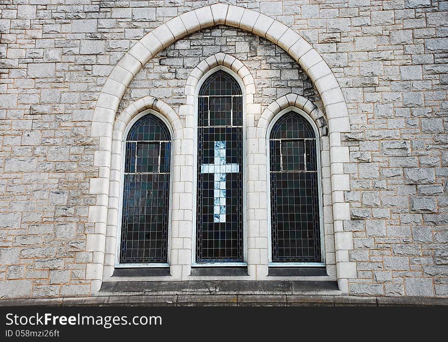 Old church window in brick wall